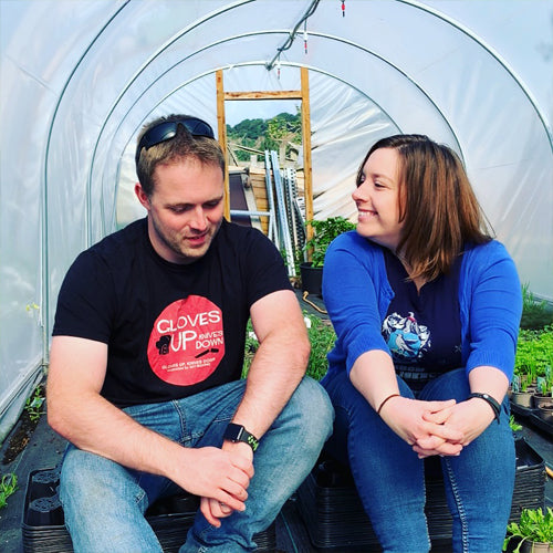 Andy and Kate sat chatting in the polytunnel