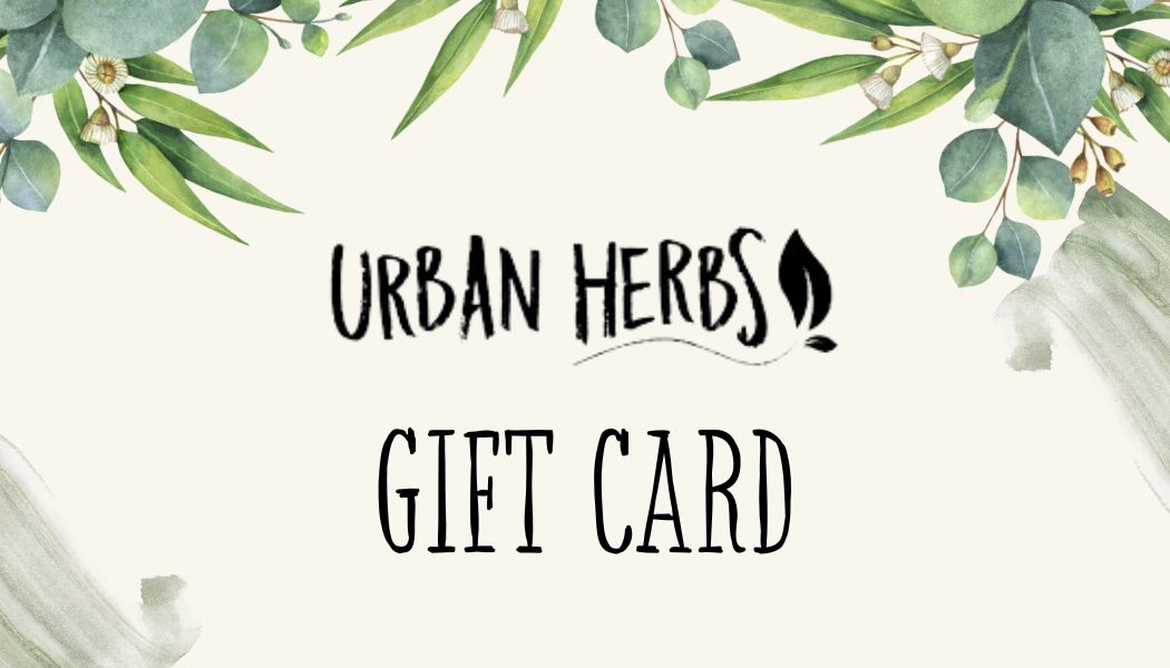 An illustration of various herbs around a gift card